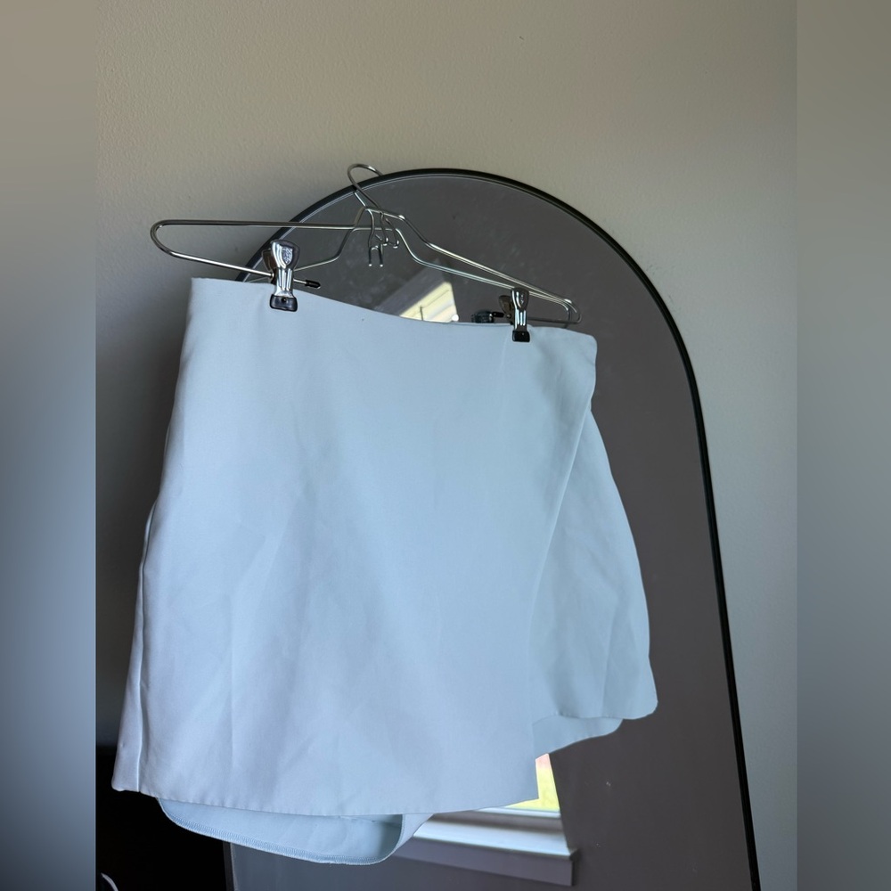 Asymmetrical high-waisted skort light blue
